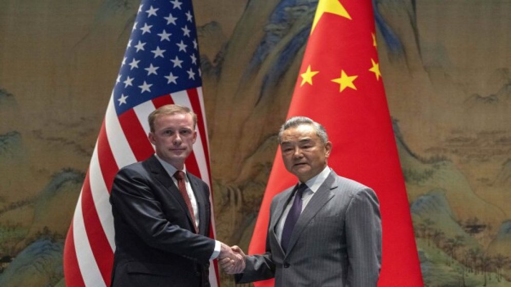 A top White House official says US and China are working to avoid conflict at talks in Beijing