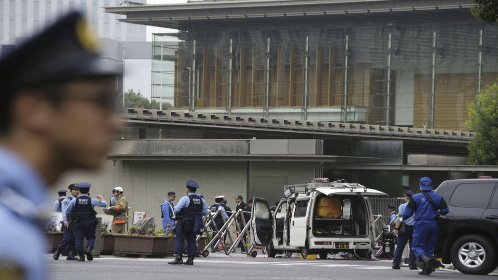 Japan's ruling party headquarters is attacked with firebombs and suspect is arrested, media report